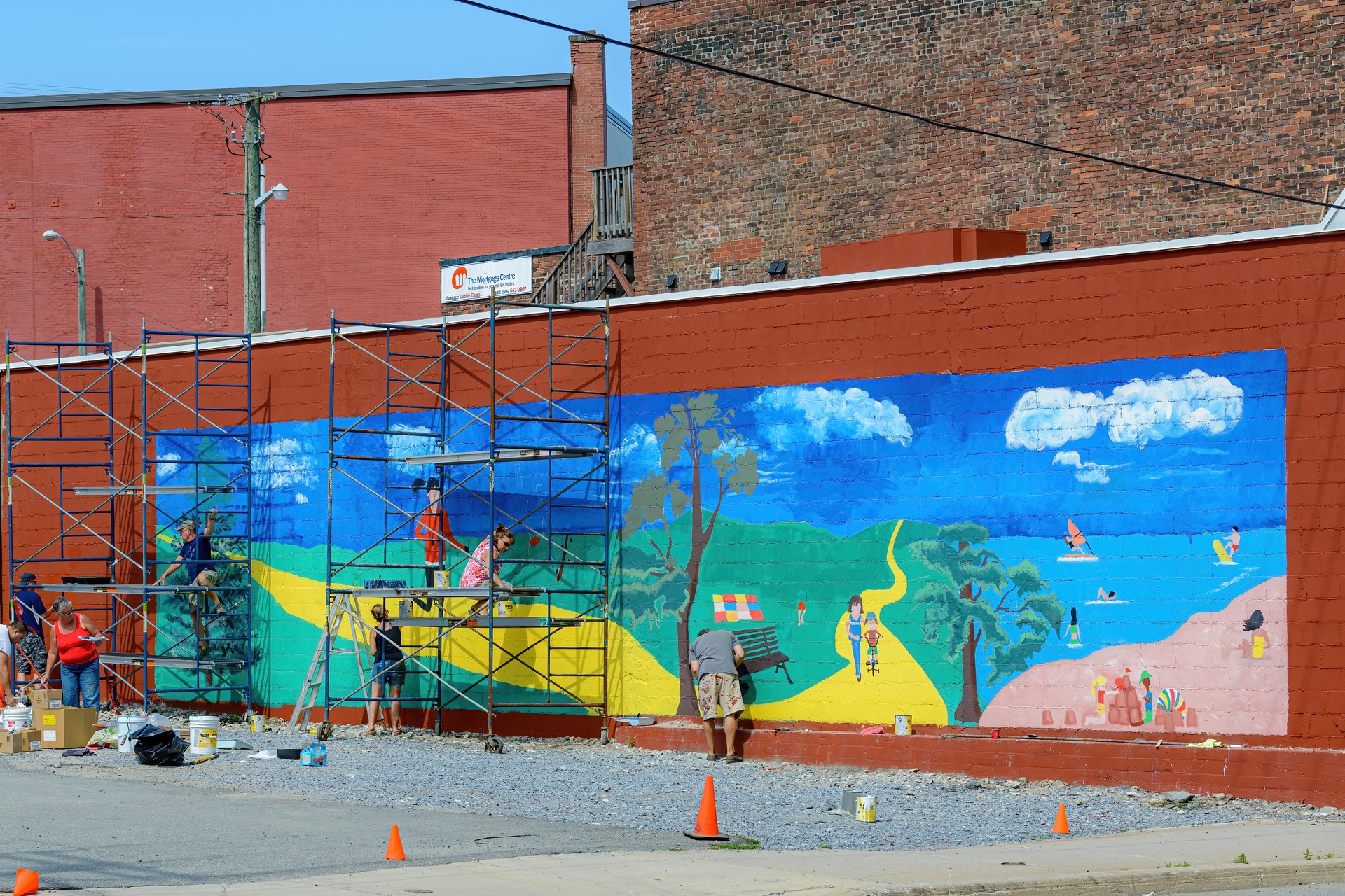 Painting A Mural On The Side Of A Building